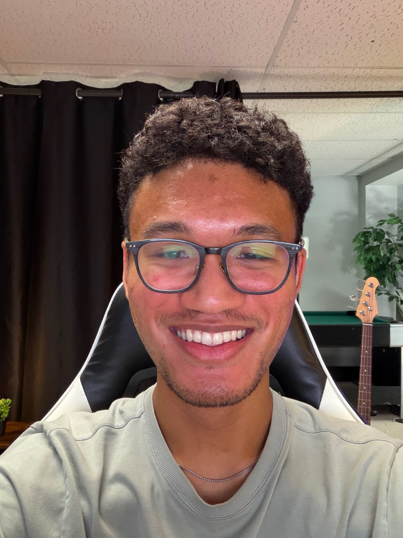 Liyoung Martin smiling in his music studio